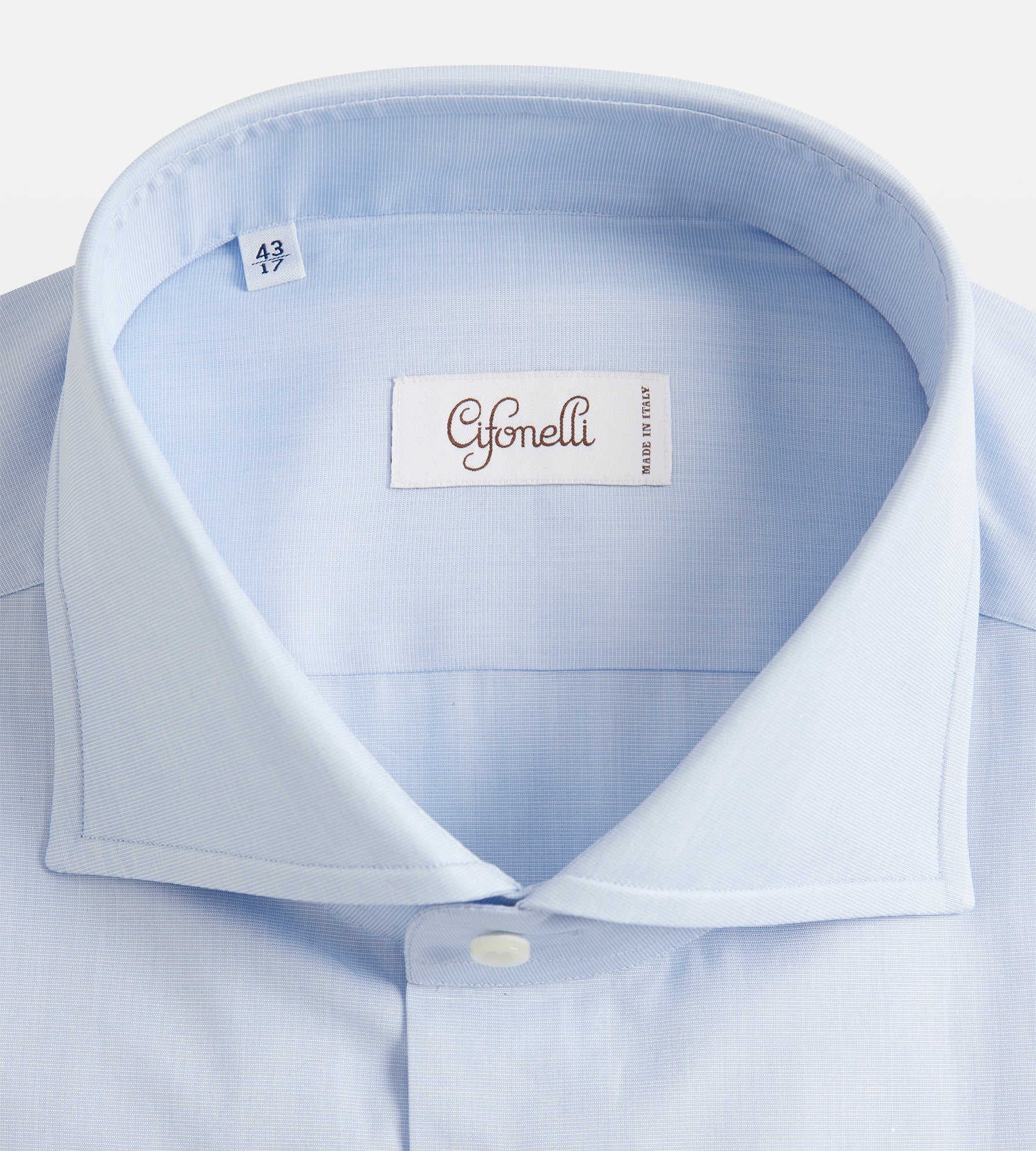 Chemise bleue en coton à poignets mousquetaires
